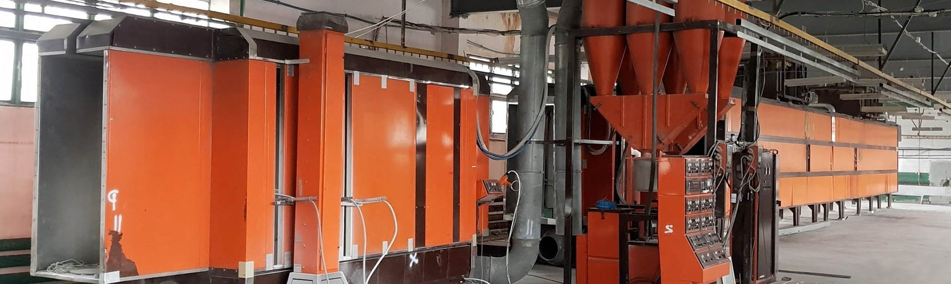 Powder coating finish being applied to steel components at Flomet